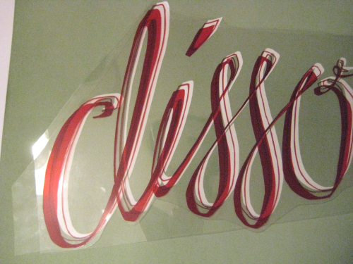 printed script letters with rubylith transparencies over them